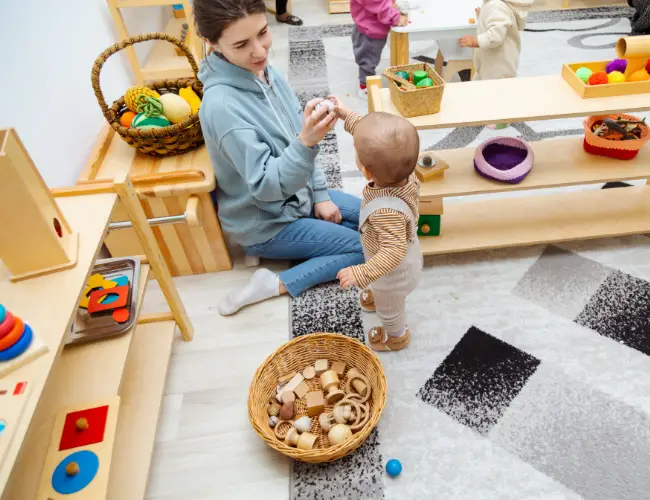 a child and adult in a montessori classroom