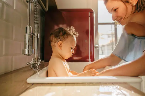a sink insert allows you to give baby a bath right in the kitchen sink - best baby bathtubs 2023