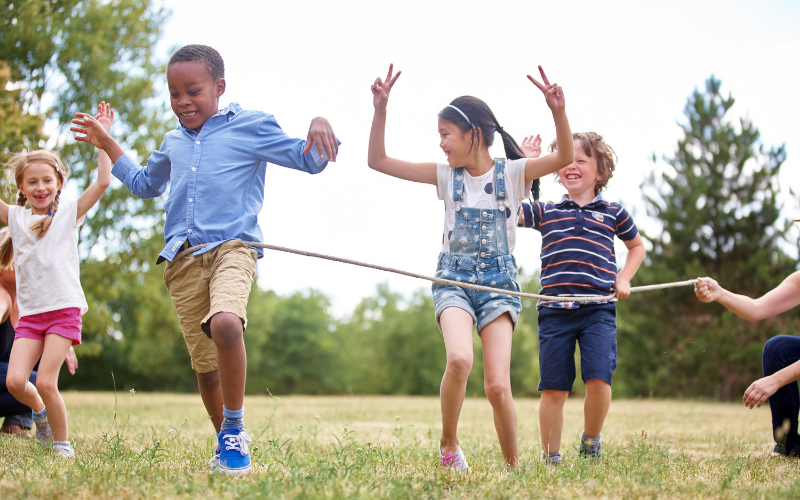 diverse group of school children racing