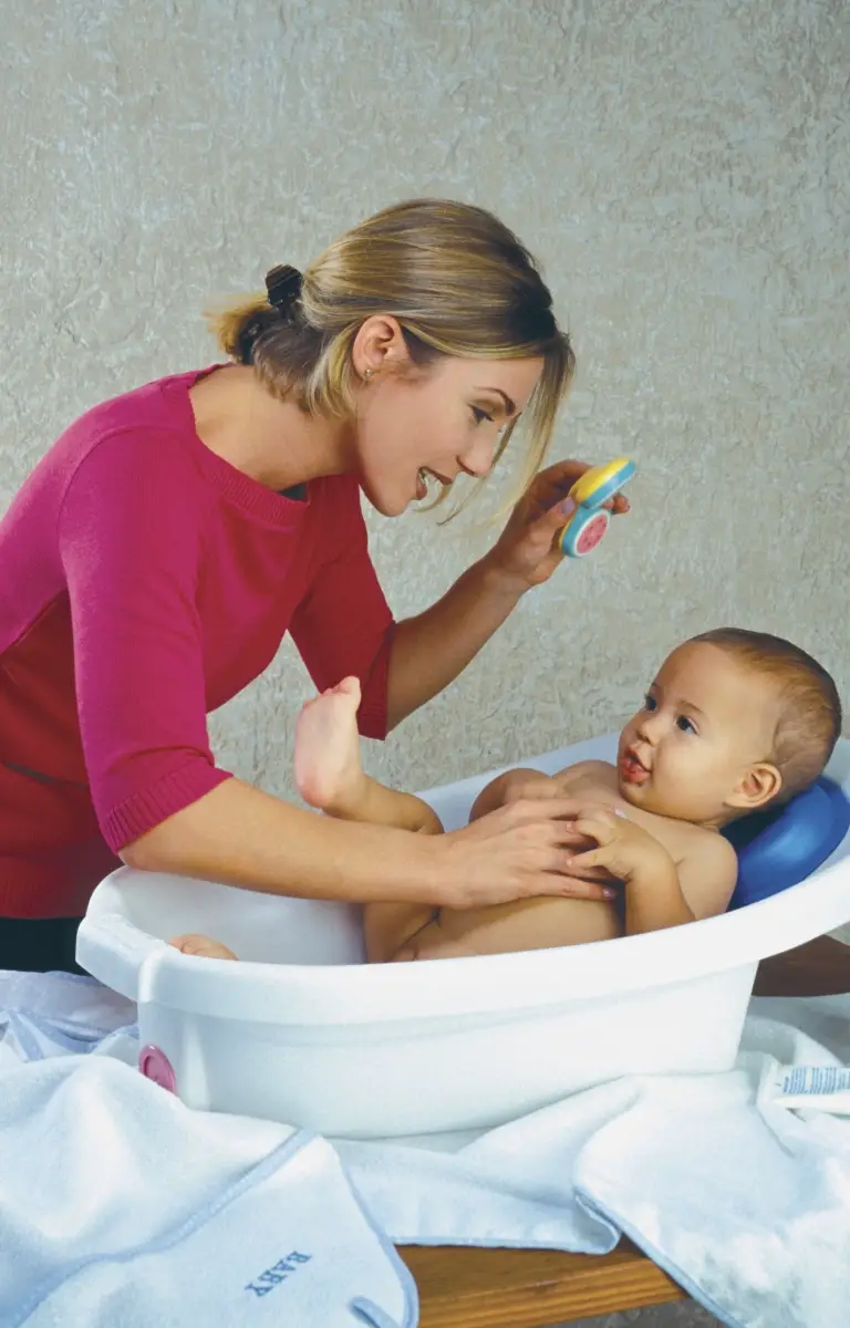 a bath cushion saves your knees when giving baby a bath - best baby bathtub 2023